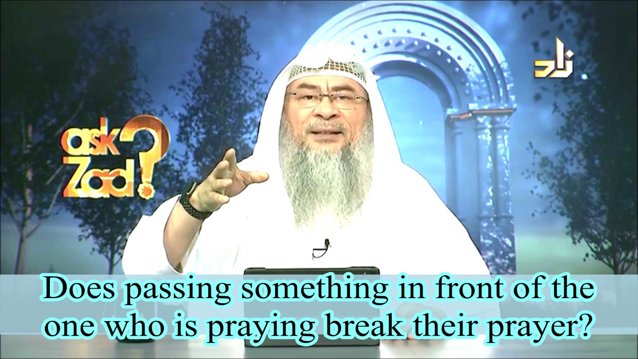 QUESTION: I was praying without anything on the floor a woman saw and tried to put a sijadah in front of my but her whole arm came in front of me while I was praying should I repeat the salah?